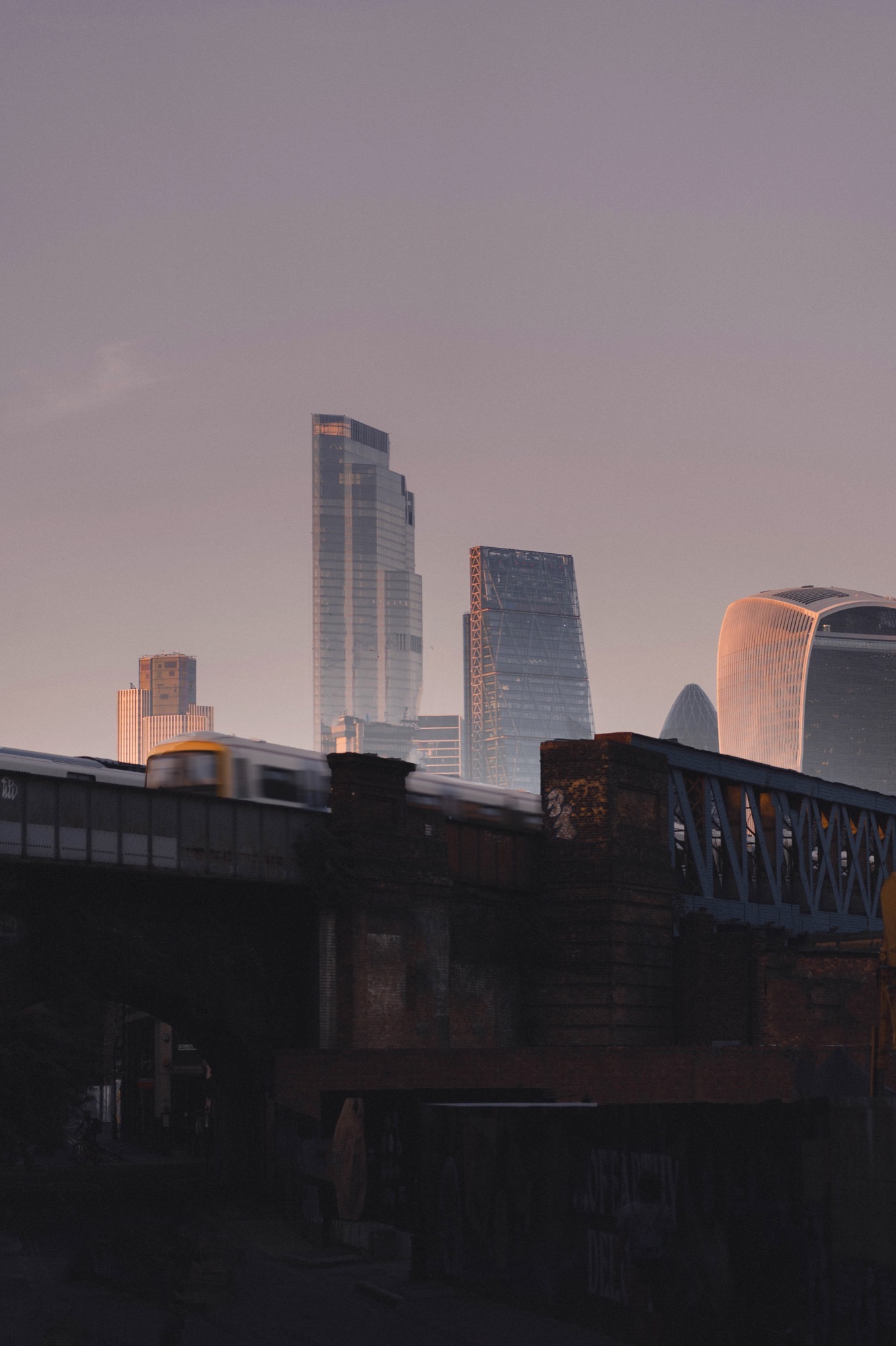 Cityscape photography - London skyline train bridge