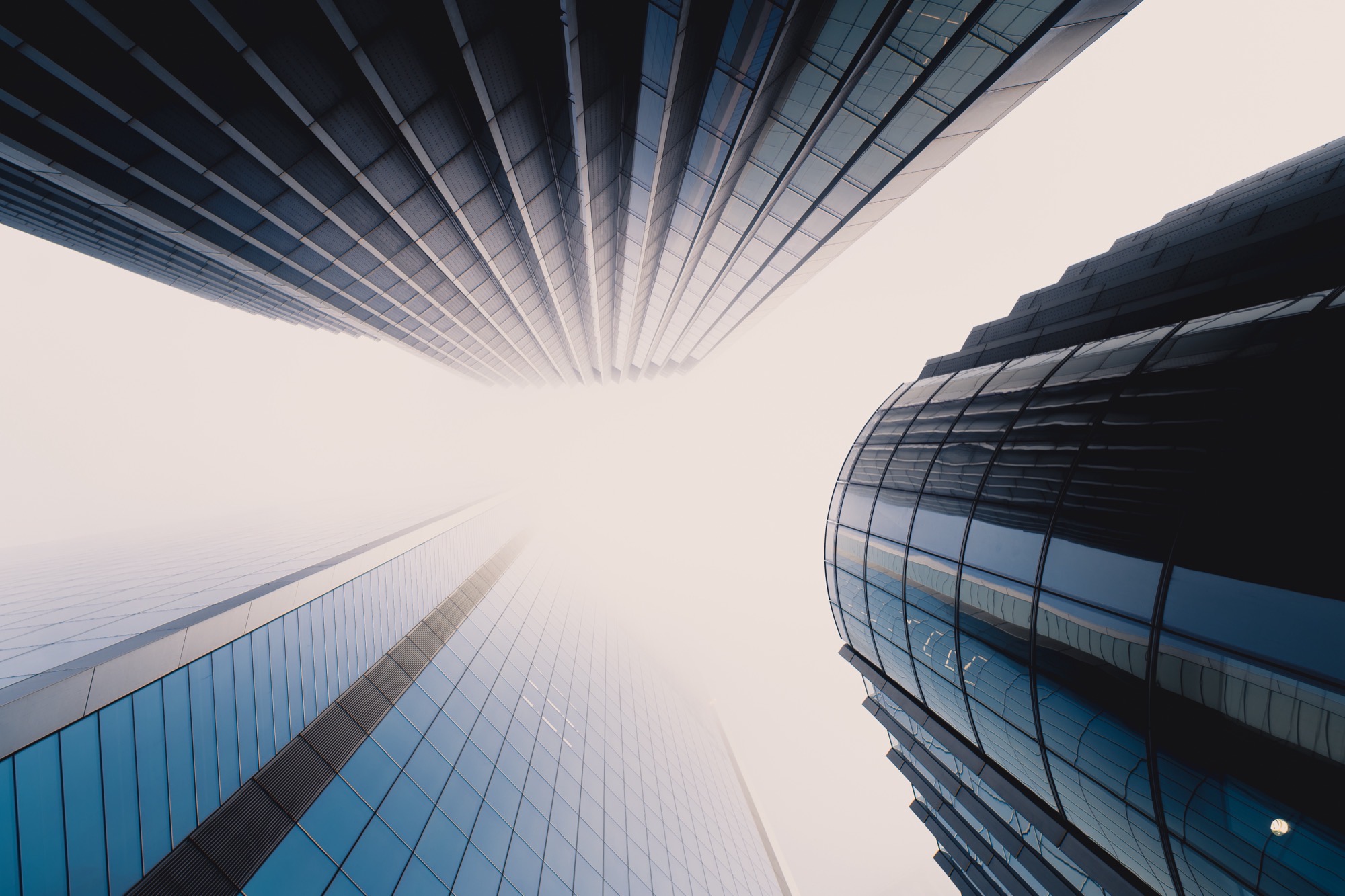 Cityscape photography - skyscrapers lookup in fog