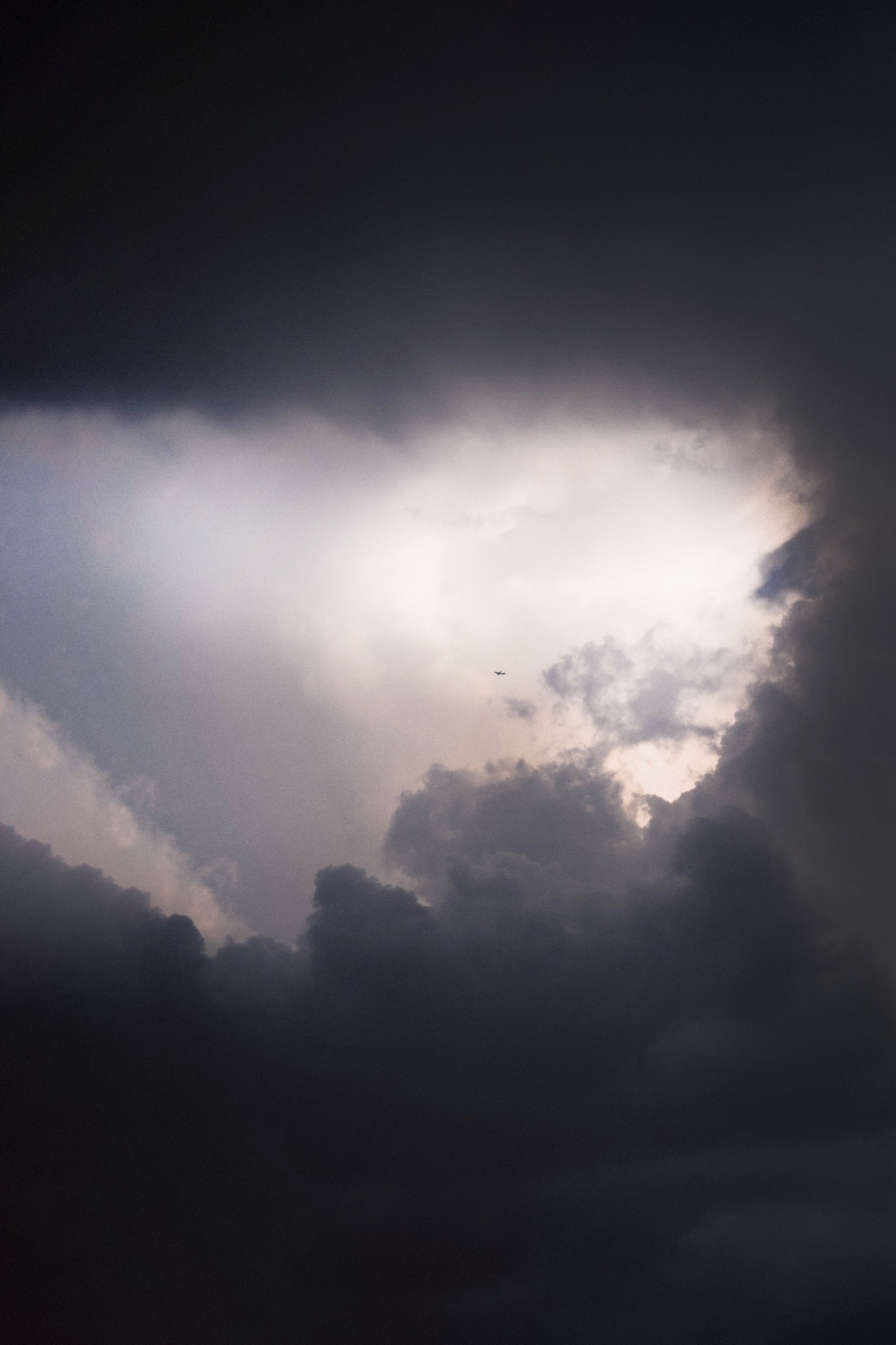 Landscape photography - dramatic clouds with plane