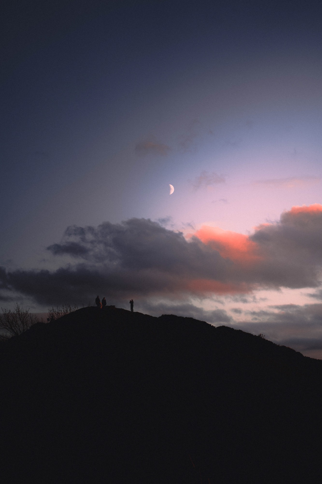 Landscape photography - hilltop silhouette with moon