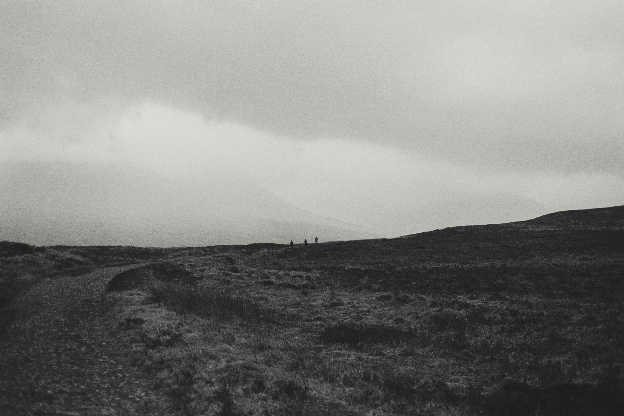 Landscape photography - moorland hikers in mist