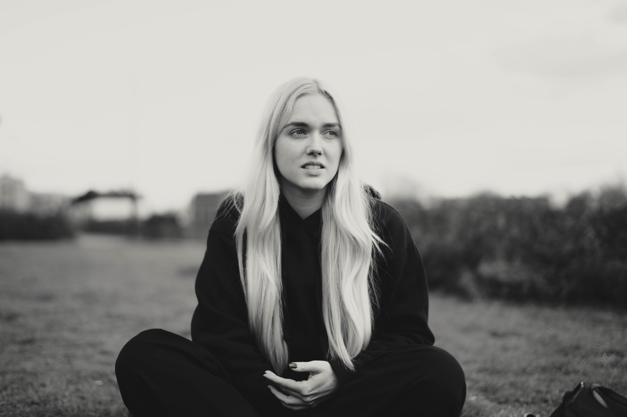 Portrait photography - blonde woman in field B&W