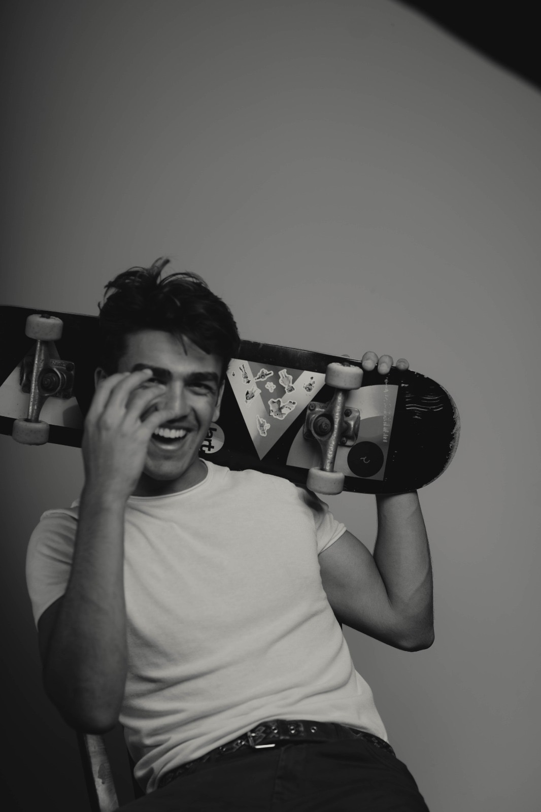 Portrait photography - man laughing with skateboard