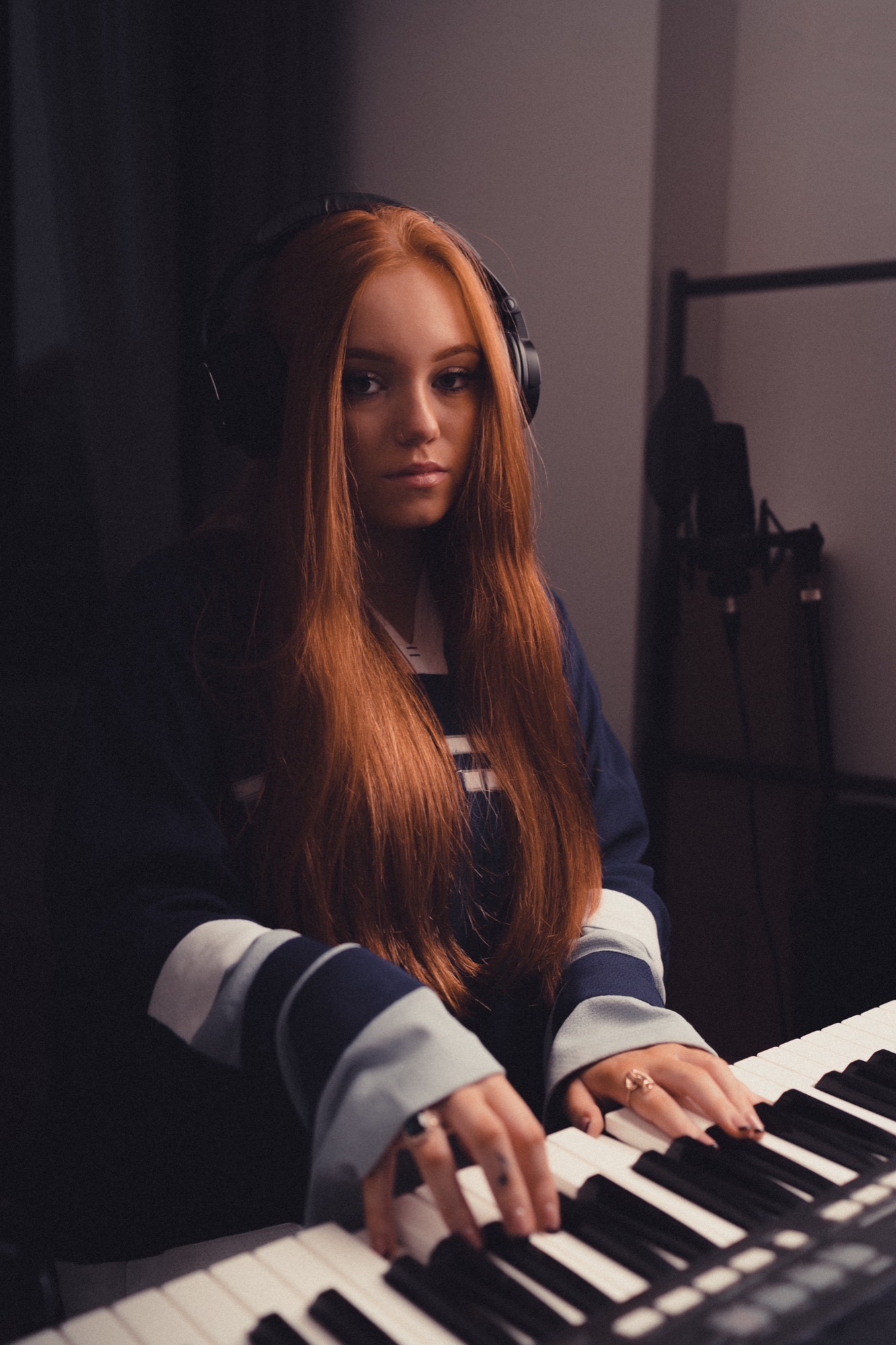 Portrait photography - red-haired woman at keyboard