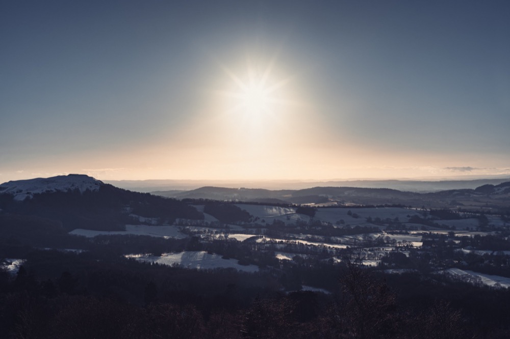 Landscape photography - snowy hills sunset