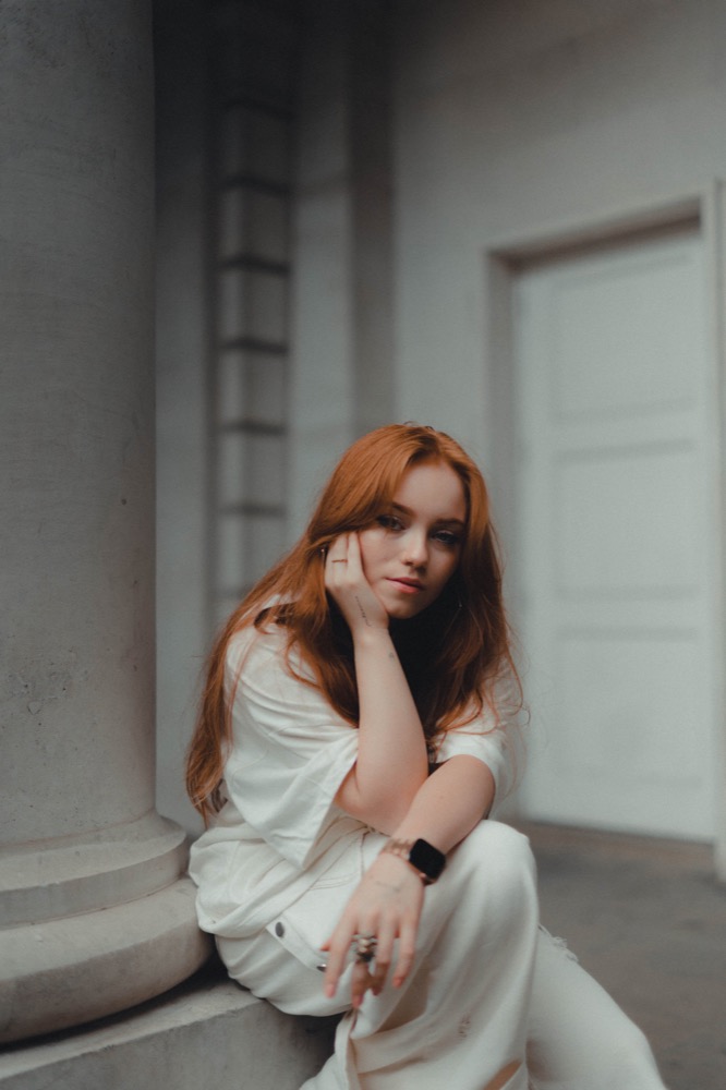 Portrait photography - woman by column